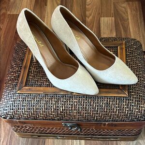 Taupe suede pumps.